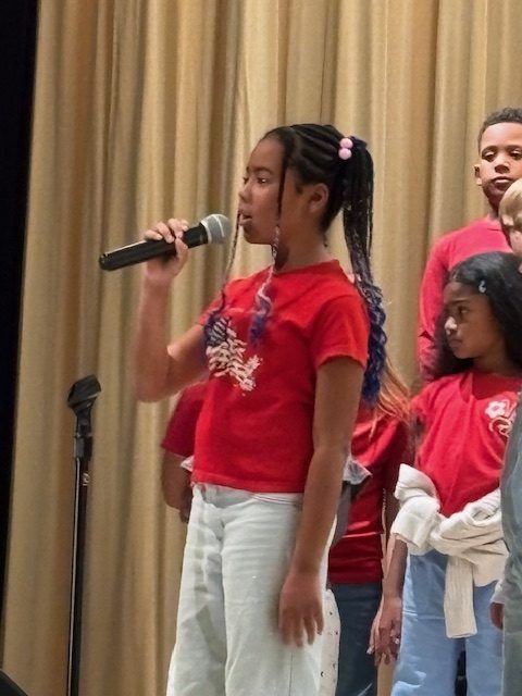 student with microphone